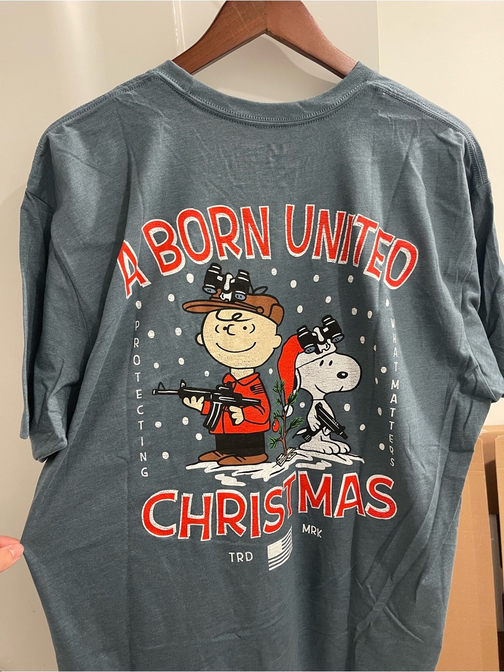 Charlie Brown and Snoopy ‘A Born United Christmas' Short Sleeve Graphic Tee